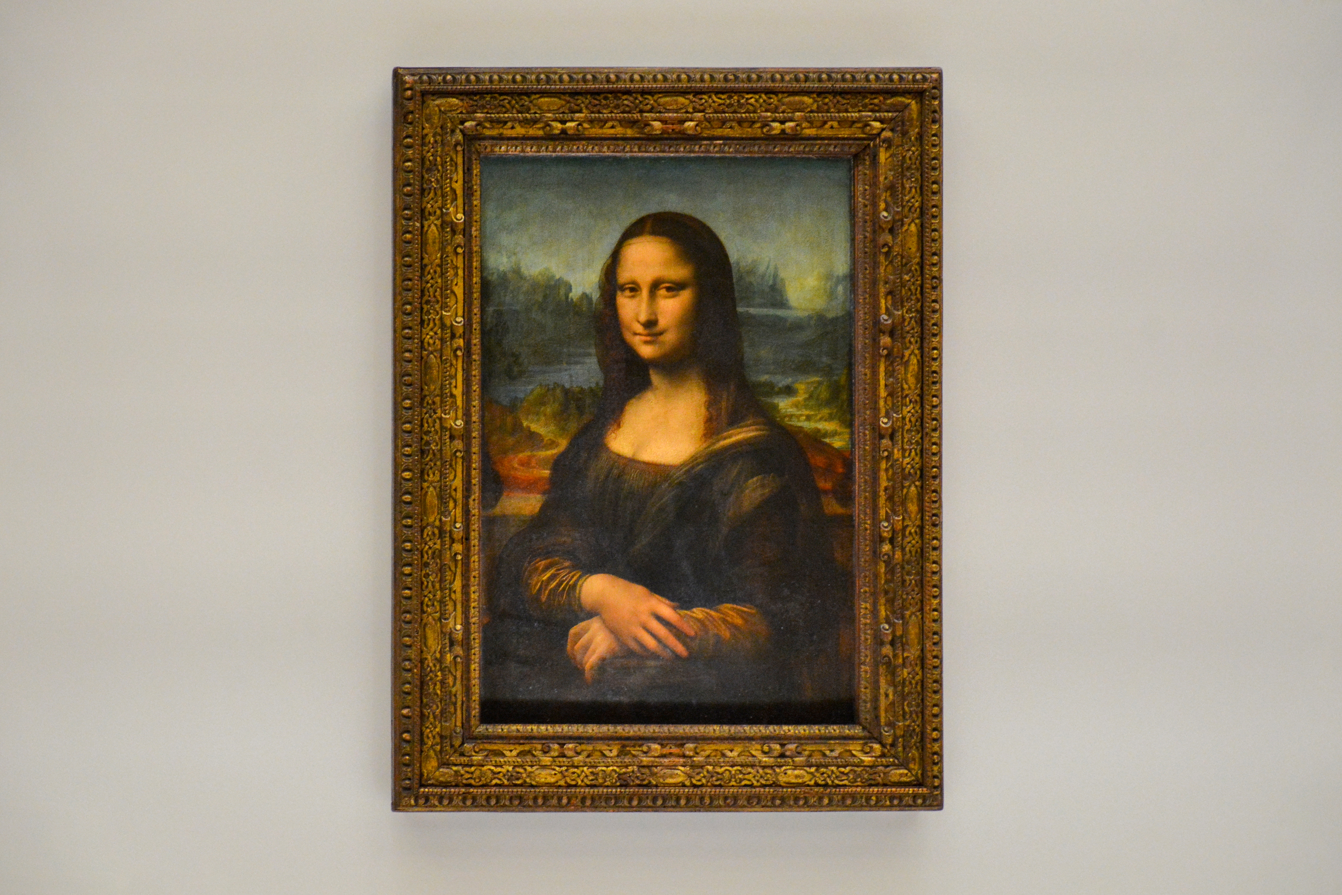 The Mona Lisa painting by Leonardo da Vinci, displayed in the Louvre Museum in Paris, France.