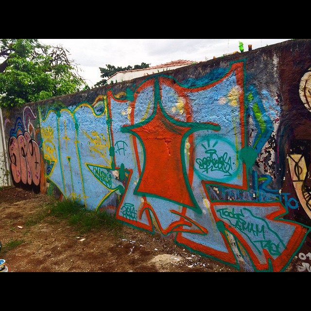 Vibrant graffiti art covering a concrete wall in São Paulo, Brazil, showcasing diverse styles and colors.