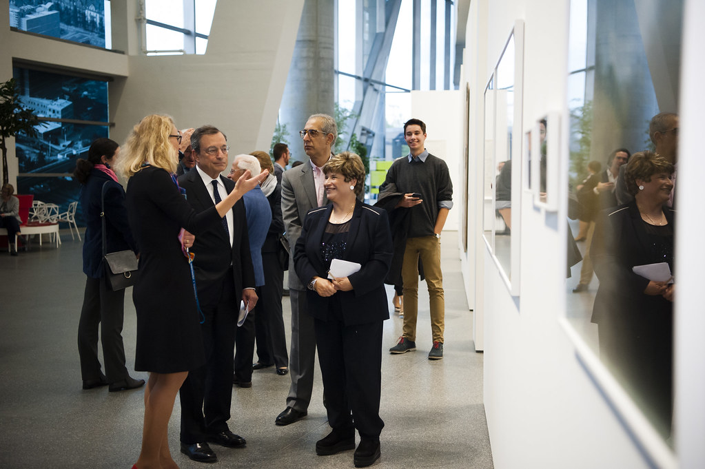 Attendees discuss artwork during the Cyprus Contemporary Art Exhibition opening in September 2015.