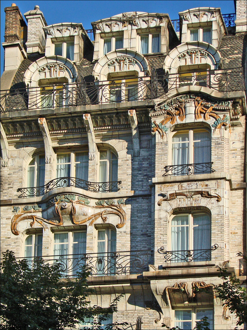 Art Nouveau facade of Hôtel Céramic in Paris with ornate balconies and dormer windows