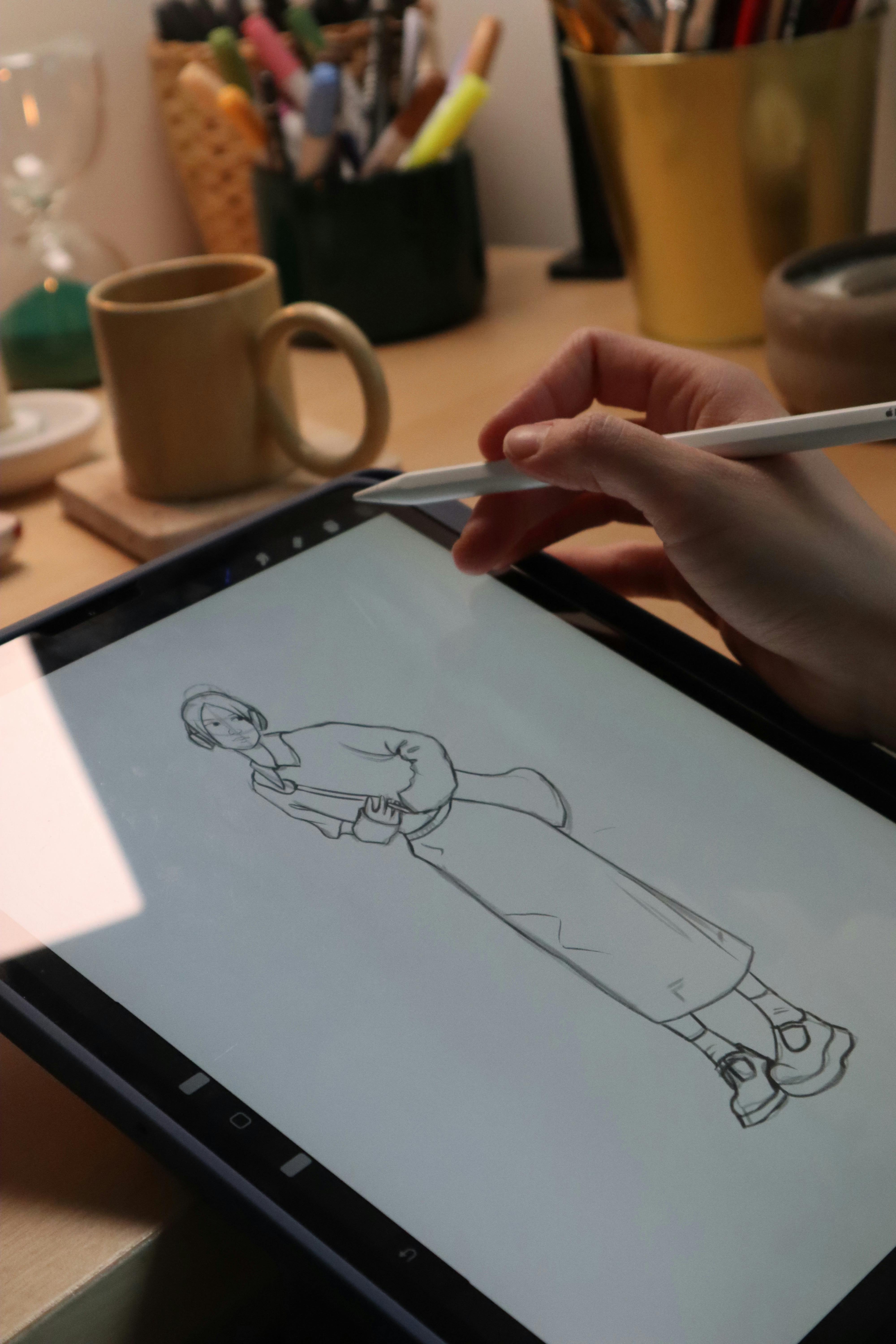 Digital-sketching-on-tablet-at-cozy-workspace