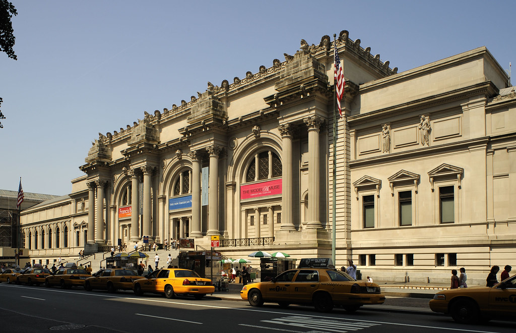 Angled view of the Metropolitan Museum of Art's main facade and street entrance.