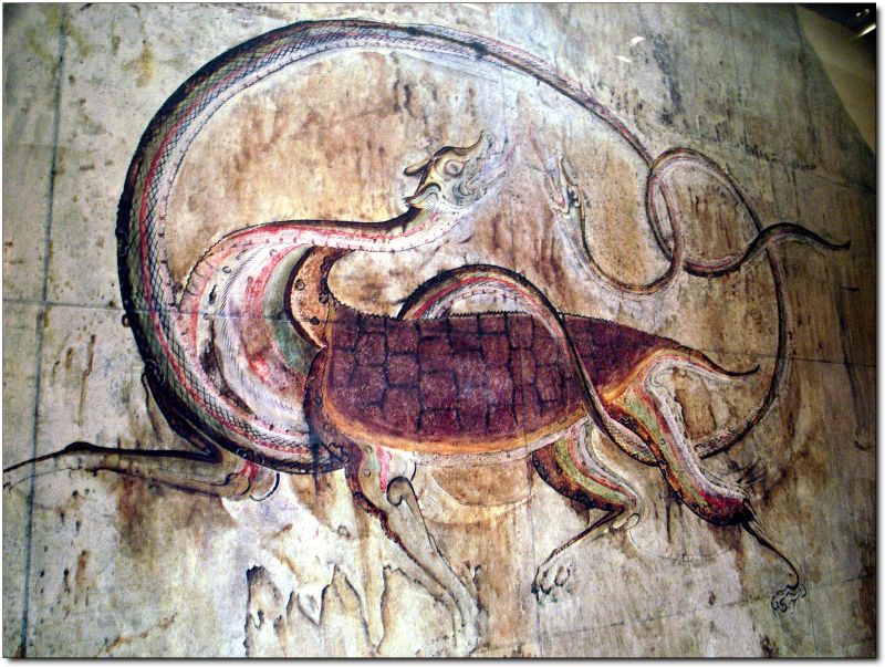 Ancient mural depicting a serpent coiled around a creature, symbolizing the serpent in art history.