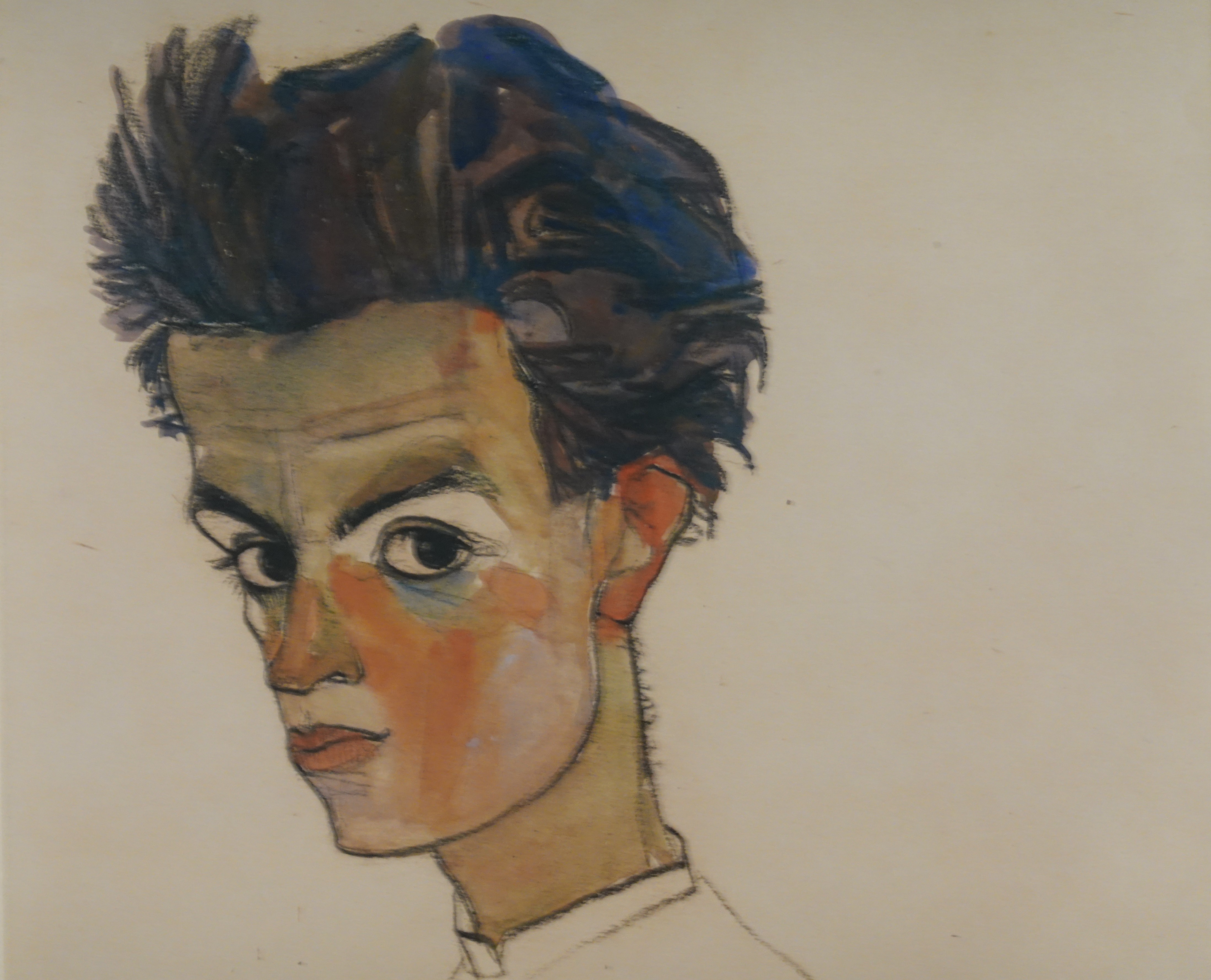 Egon Schiele Self Portrait 1910, a striking watercolor and pencil drawing of the artist's head and shoulders, showcasing his intense gaze and distinctive style.