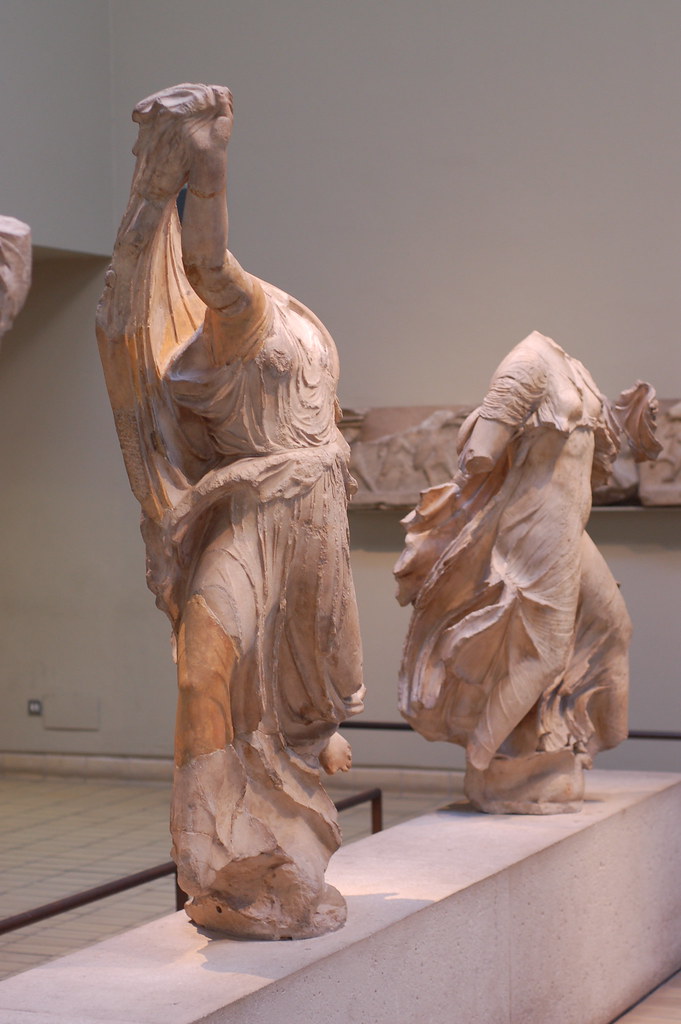 Statues from the Elgin Marbles at the British Museum showcasing ancient Greek sculpture in meticulous detail, reflecting classical antiquity and cultural heritage.
